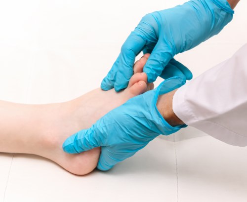 doctor examining foot